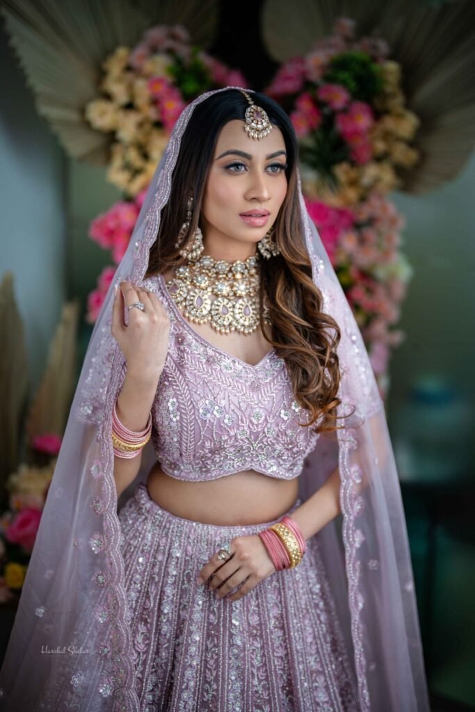 Emerald choker paired with pastel bridal lehenga