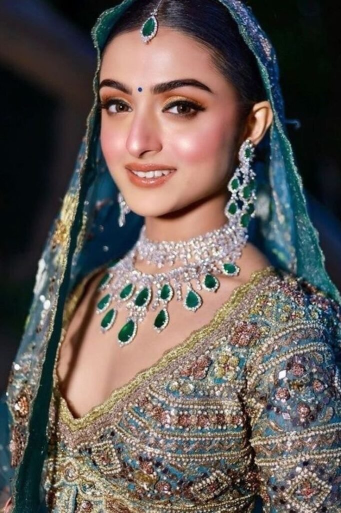 Bride wearing diamonds with royal blue lehenga