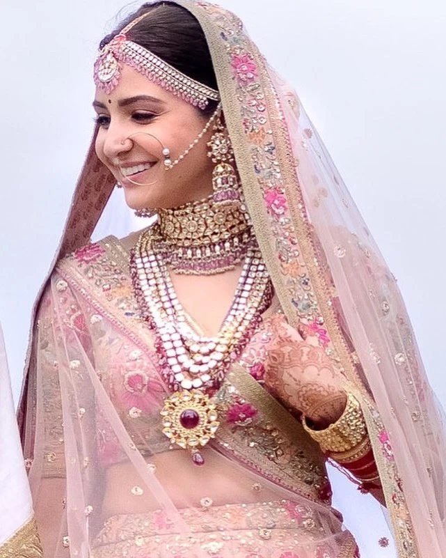Gold lehenga paired with layered gold jewellery