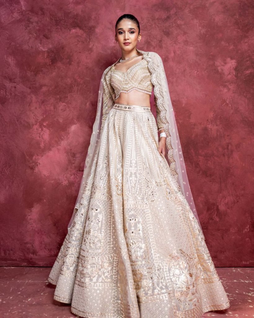  Bride wearing dupatta styled like a cape