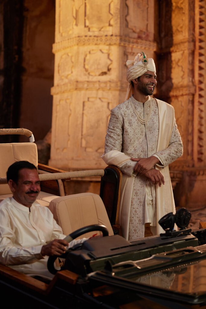 Classic ivory sherwani styled with traditional accessories