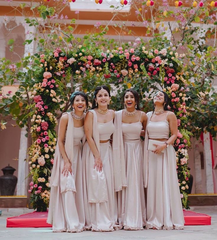 Bridesmaids posing in coordinated outfits