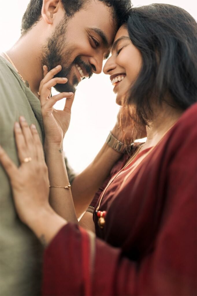 Couple laughing naturally during pre-wedding photoshoot
