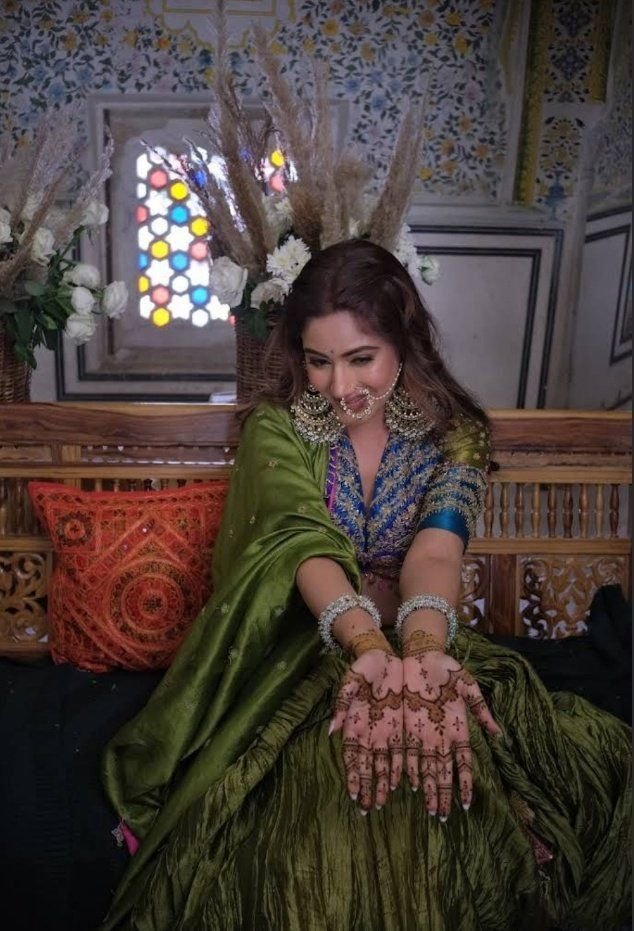 Bride showing simple mehndi design