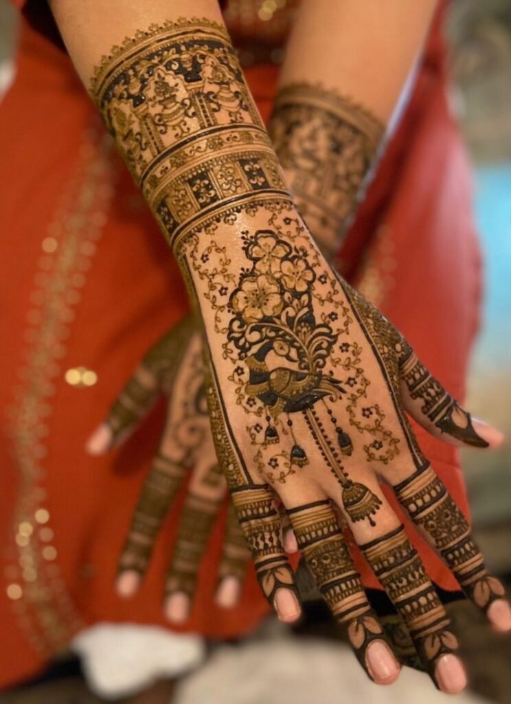 Fine-line bridal mehndi with negative space on bride’s hands