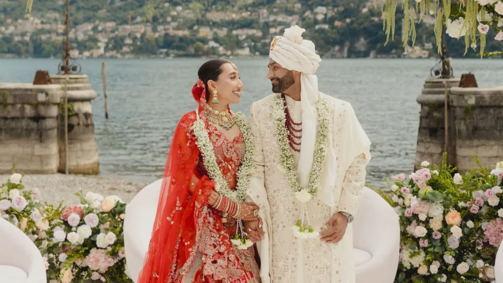 Wedding couple pose by a lake at Lansdowne