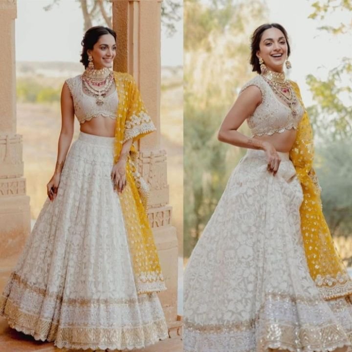 Bride wearing yellow and white outfit for haldi