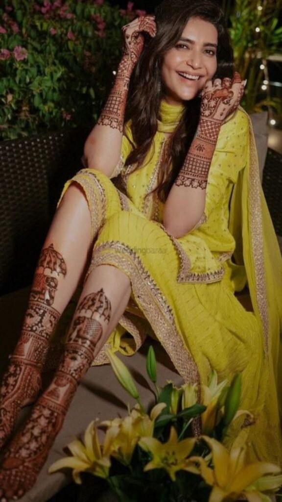 Bride in colorful outfit matching mehndi theme