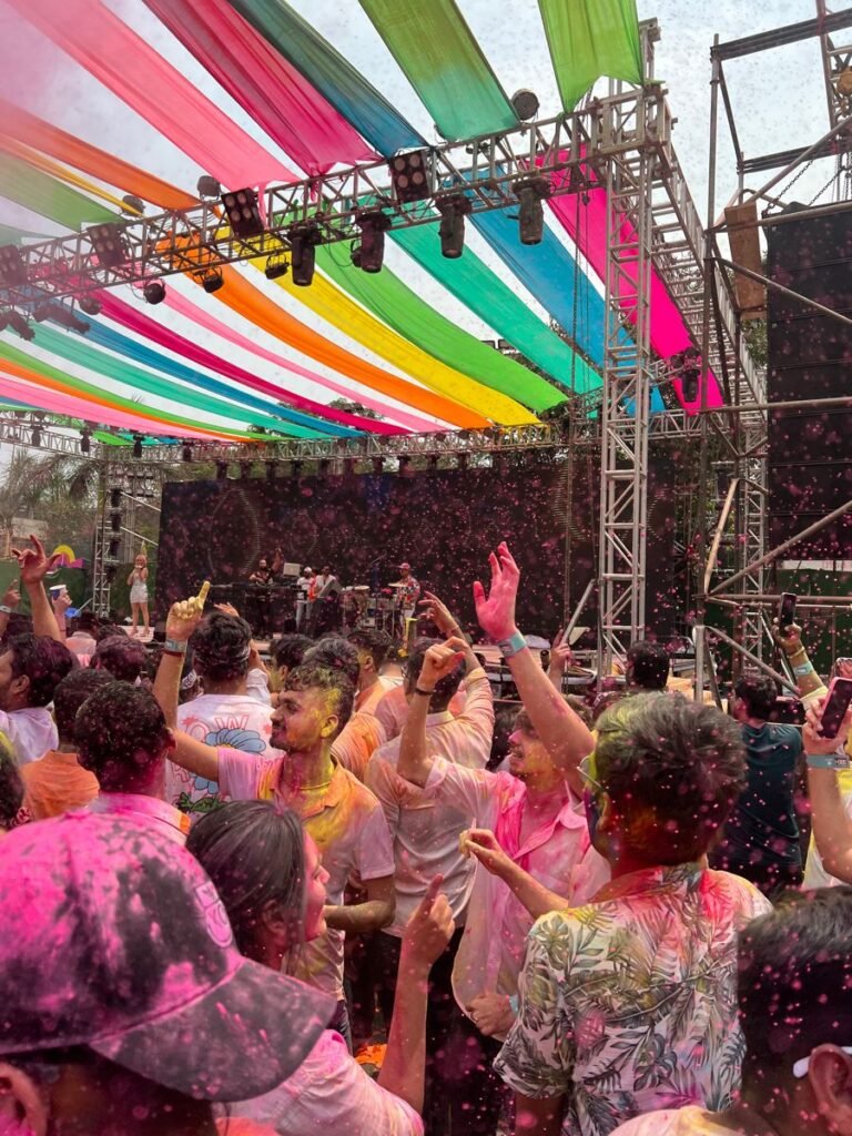  DJ setup playing Holi party music outdoors