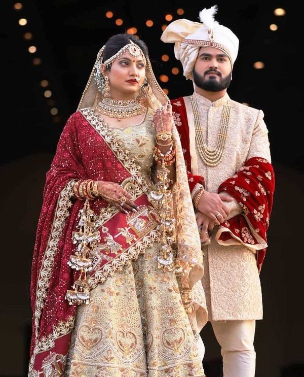  Groom wearing embroidered dupatta.